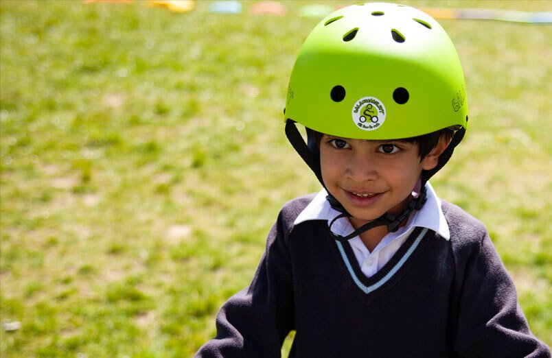 St Margarets School Balanceability pupil learning to ride bike in playground